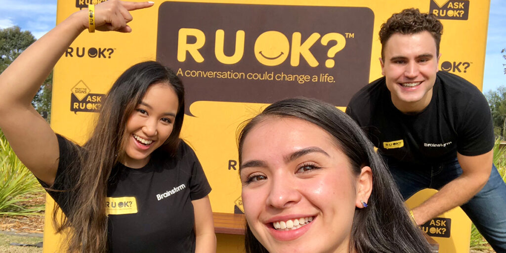 Three Brainstorm actors at an R U OK event