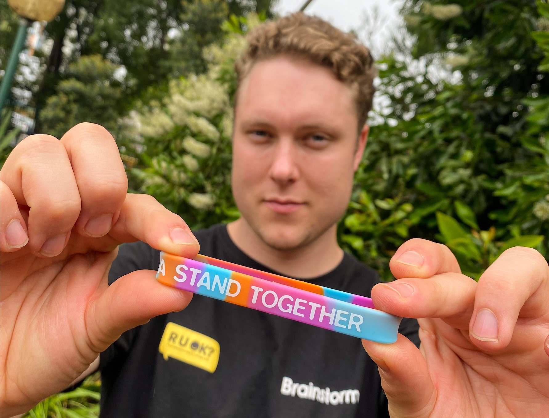 Blake holds a National Day of Action wristband