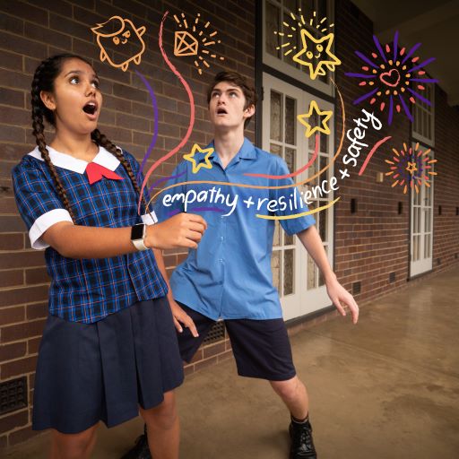 Promotional image of two students in school uniforms, both looking at exciting illustrations coming out of a smart watch, and the words empathy, resilience and safety